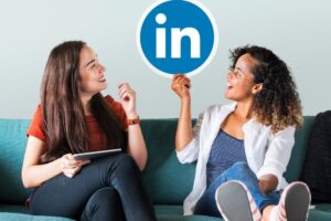 linkedin marketing women holding linkedin logo